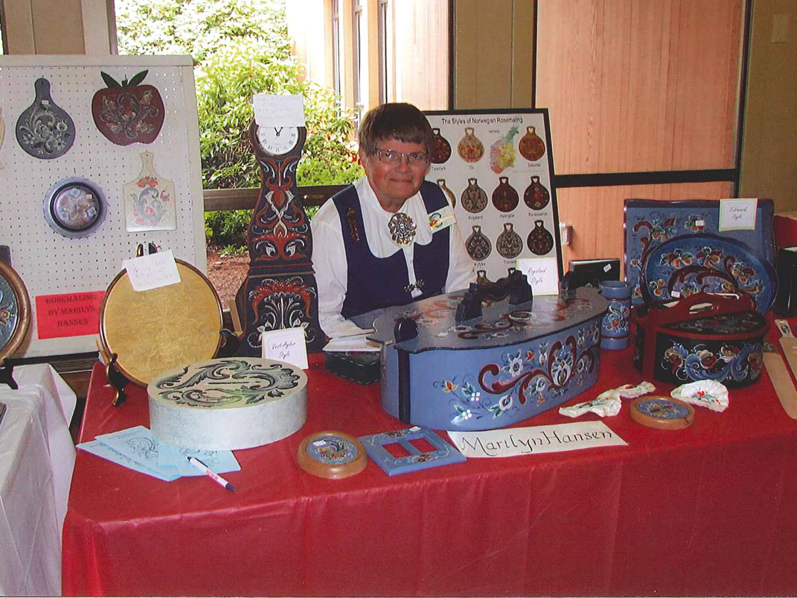 Norwegian Heritage Festival - a woman selling items with rosemal