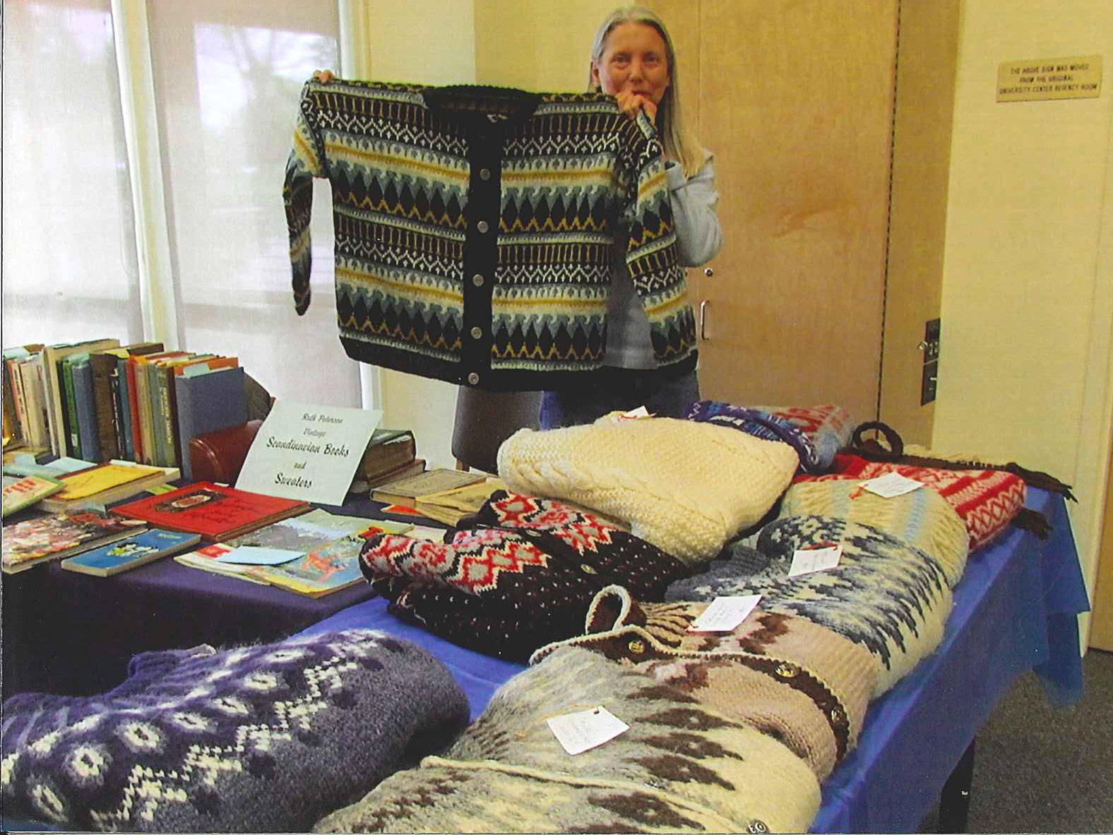 Norwegian Heritage Festival - a woman selling sweaters and books
