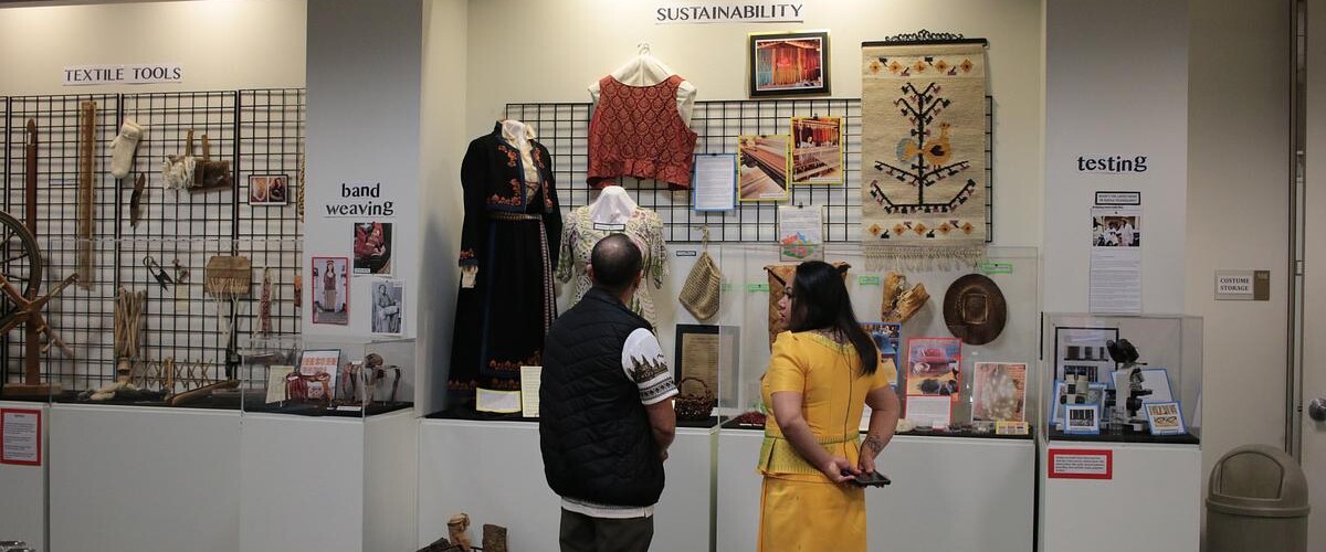 Couple standing together in front of an exhibition
