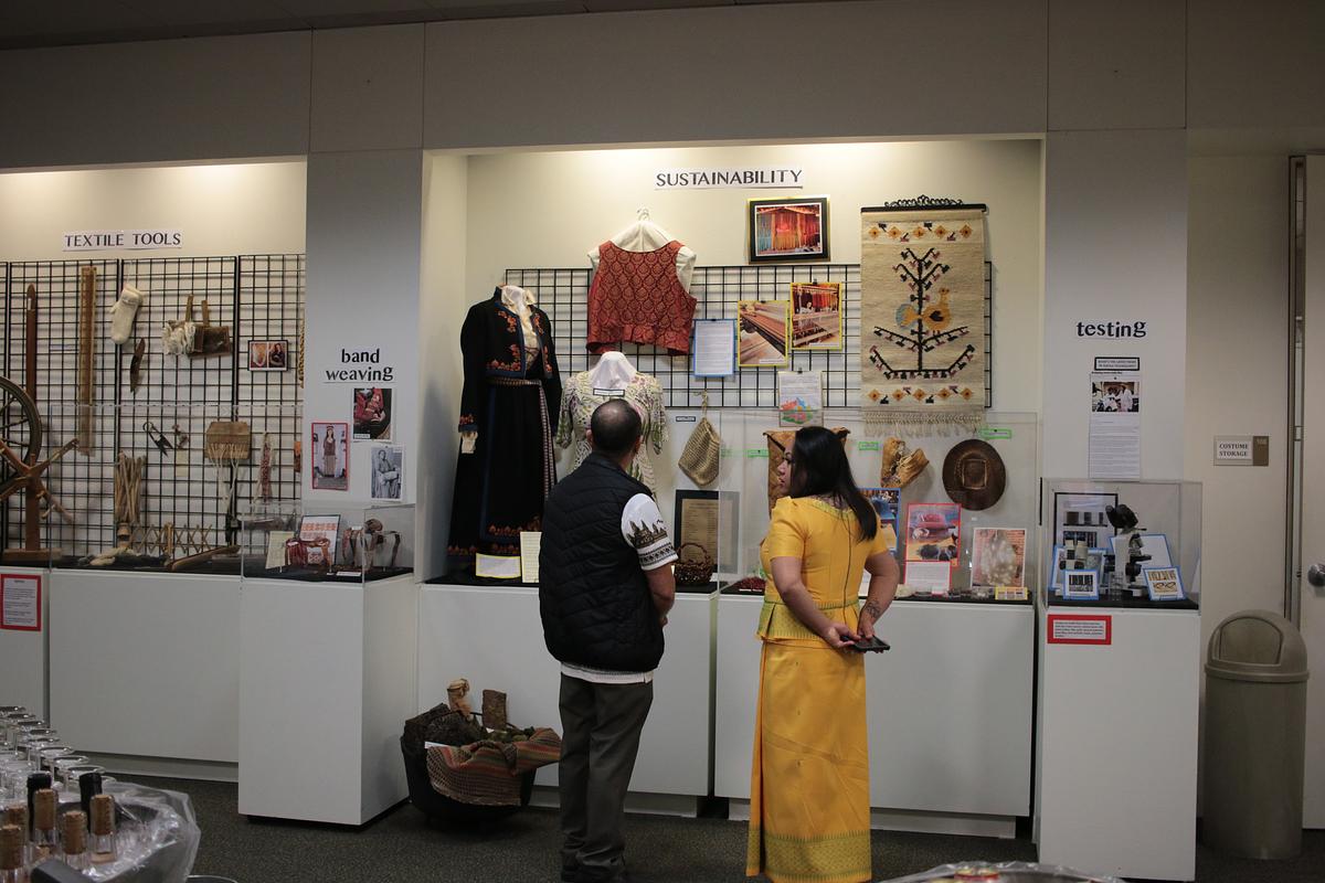 Couple standing together in front of an exhibition