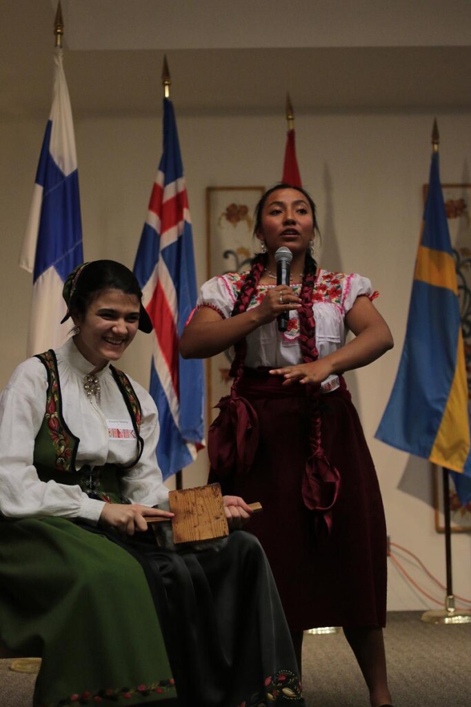 Demonstration of carding wool onstage
