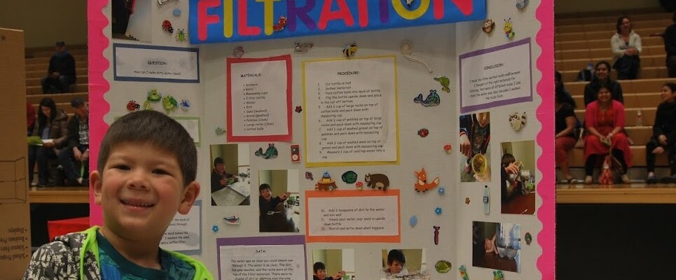 Science Fair student showing off his project.JPG