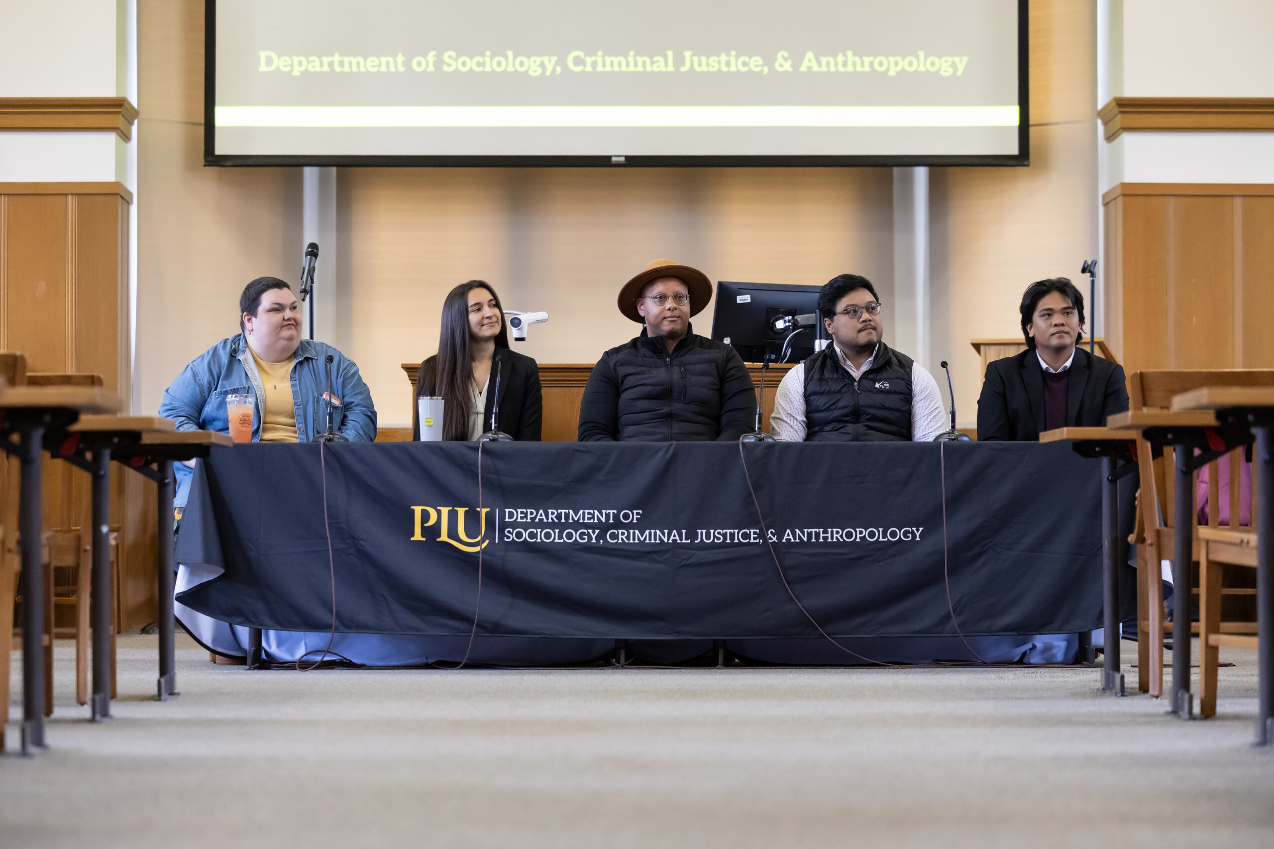 Five panelists seated at table for Department of Sociology Criminal Justice Anthropology panel discussion