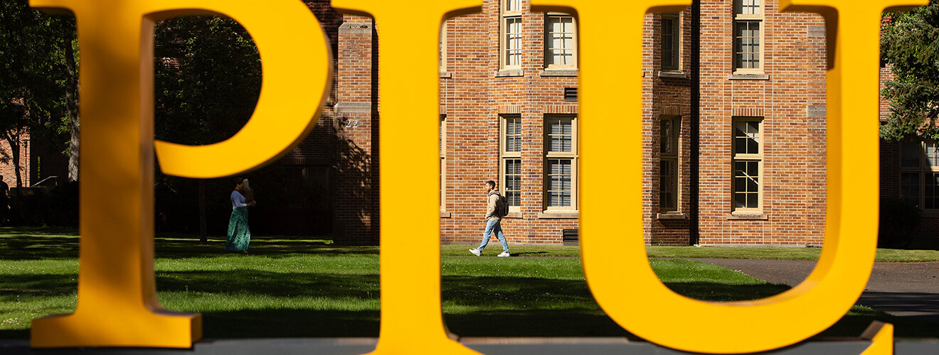 PLU Sign in front f Xavier Hall on the PLU campus.