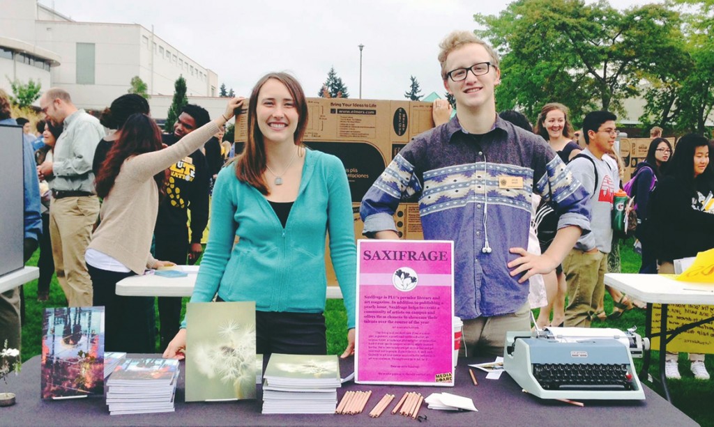 Saxifrage Team -two students behind a table