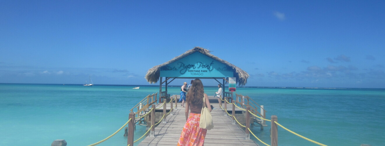 student walking on dock in the Caribbean in Trinidad & Tobago