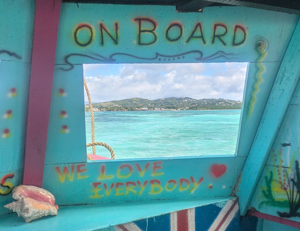 rsz_1wang_center_staff_pick_brooke_melburn_people_&_culture_12 view through a boat window on the Caribbean ocean in Tobago