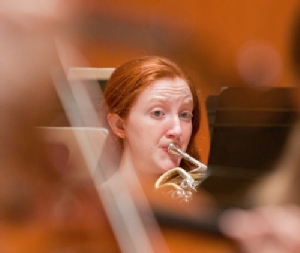 Student playing horn