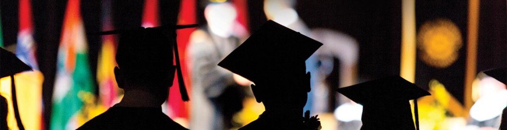 Three new gradautes at Commencement.