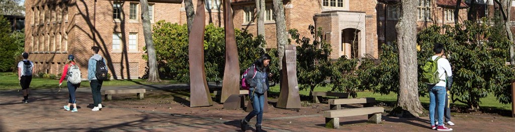 PLU students walking on Red Square with Xavier Hall in the background.