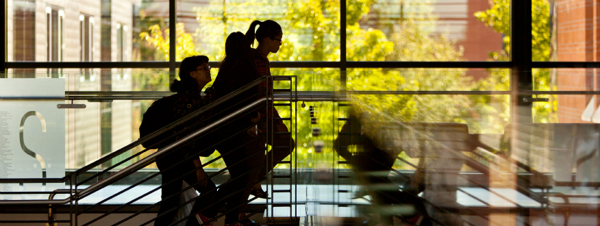 Students walking upstairs in Morken building