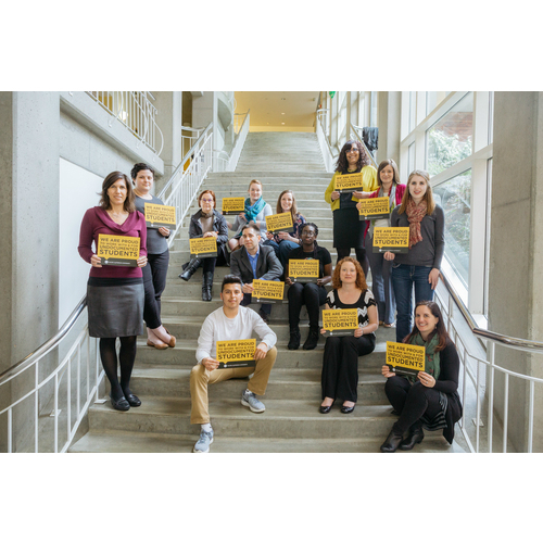 plu4us Students and Professors holding signs