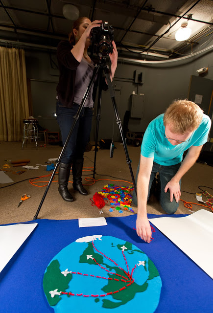 Students working on a sustainability-video Katie Martell & John Struzenberg working on a video about sustainability & study away. Photo by John Froschauer
