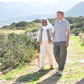 01-1 Chris Stevens walking with another person