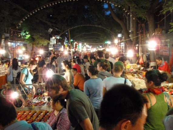 Wind Ensemble touring a street market in China