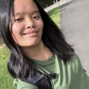 Mia Ruhoff outdoors in a grassy area, wearing casual clothing.