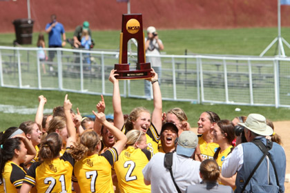 PLU Softball champions holding trophy